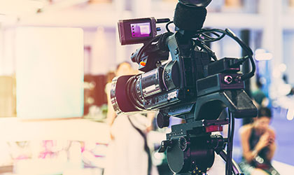 We see a television camera ready to shoot