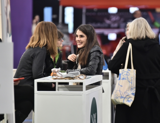 Visitor engaging with an exhibitor at SIA'PRO