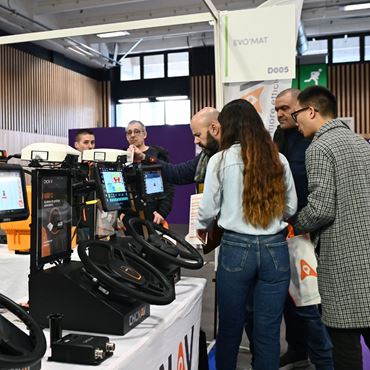 An exhibitor demonstrates connected agricultural equipment to a group of visitors at SIA’PRO.